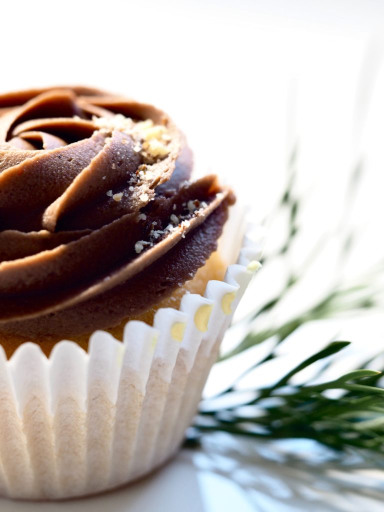 Rose chocolate buttercream swirl on a cupcake